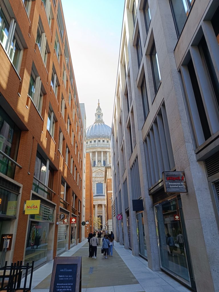 View of St Paul's Cathedral from Queens Head Passage after coming off the bus stop