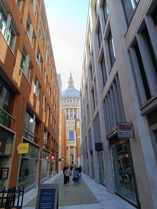 View of St Paul's Cathedral from Queens Head Passage after coming off the bus stop